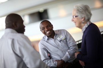 Shared Interest member talking to staff at our AGM in 2015 Shared Interest member talking to staff at our AGM in 2015